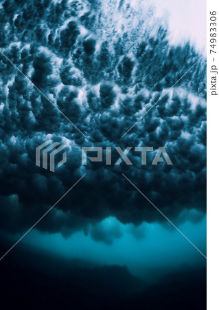 Wave with foam underwater. Transparent ocean in underwater Wave with foam underwater. Transparent ocean in underwater 74983306