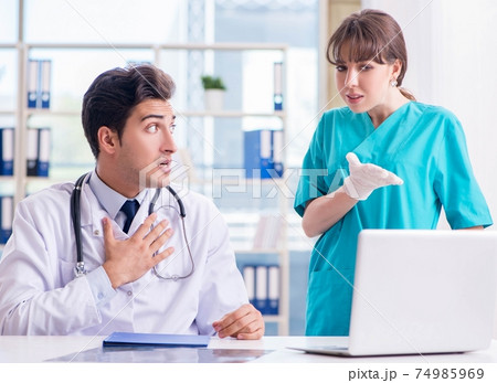 Doctor angry at his assistant due to medical error Doctor angry at his assistant due to medical error 74985969