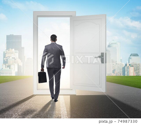 Businessman in front of door in business opportunities concept 74987330