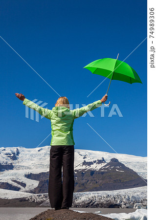 Woman Hiker WIth Green Umbrella The Vatnajokull Glacier Iceland Woman Hiker WIth Green Umbrella The Vatnajokull Glacier Iceland 74989306