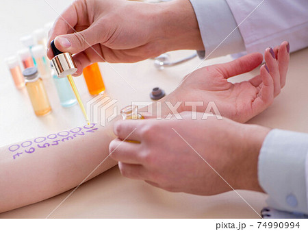 Doctor testing allergy reaction of patient in hospital Doctor testing allergy reaction of patient in hospital 74990994