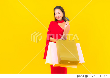 Portrait beautiful young asian woman with shopping bag and credit card Portrait beautiful young asian woman with shopping bag and credit card 74991237