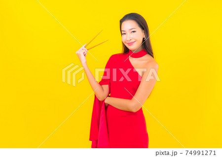 Portrait beautiful young asian woman with chopstick Portrait beautiful young asian woman with chopstick 74991271