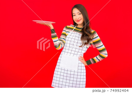Portrait beautiful young asian woman show empty dish Portrait beautiful young asian woman show empty dish 74992404