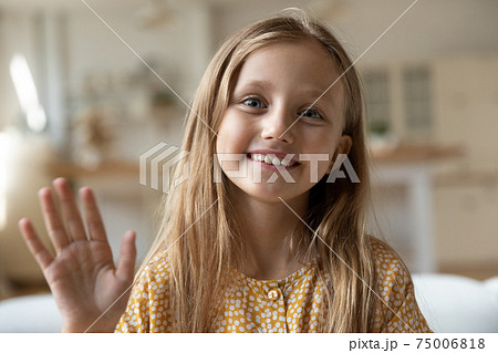 Adorable little girl calling parent from home by video link Adorable little girl calling parent from home by video link 75006818