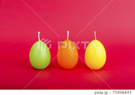 Bright colored decorative candles in shape of eggs. Bright colored decorative candles in shape of eggs. 75006843