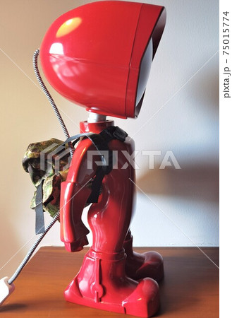 Red lamp robot side on the wooden desk 75015774