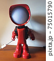 Red lamp robot front on the wooden desk 75015790