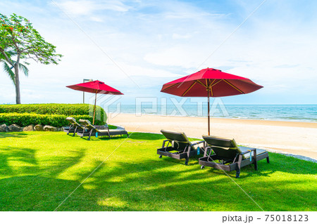 beach chair and umbrella with sea beach background beach chair and umbrella with sea beach background 75018123