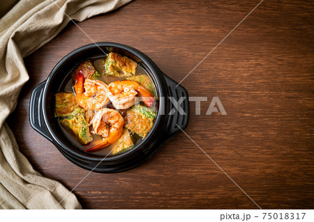 Sour soup made of Tamarind Paste with Shrimps and Vegetable Omelet Sour soup made of Tamarind Paste with Shrimps and Vegetable Omelet 75018317