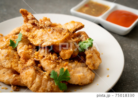 fried fish with garlic fried fish with garlic 75018330