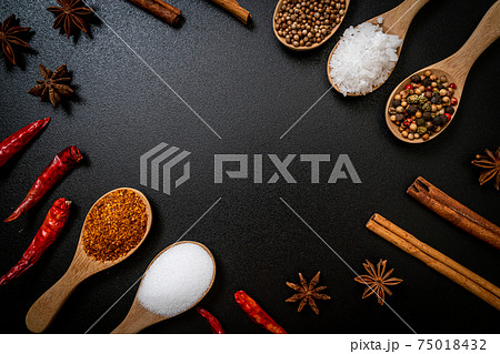 A set of spices and herbs with spoon A set of spices and herbs with spoon 75018432