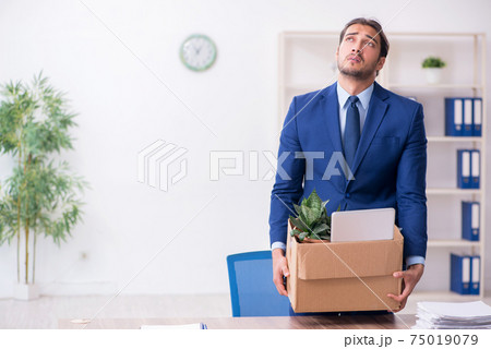 Young man being fired from his work Young man being fired from his work 75019079