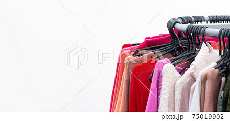 Various of colorful female clothes on hangers 75019902