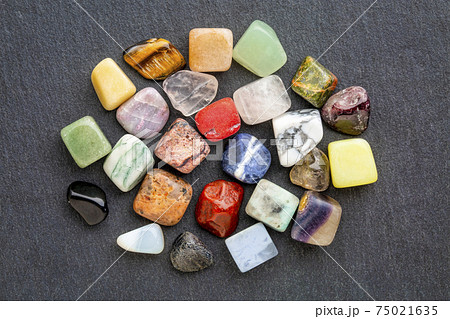 colorful gemstones on slate stone 75021635