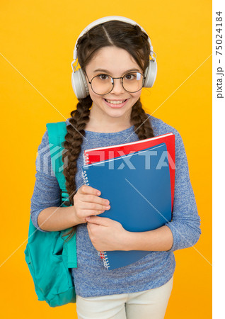 English library online. Happy kid wear headphones. 75024184