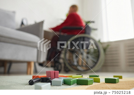 Contemporary Mother Using Wheelchair 75025218