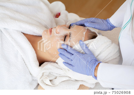 Skin Care, Beautiful Girl With Sheet Mask on Her Face. Skin Care, Beautiful Girl With Sheet Mask on Her Face. 75026908
