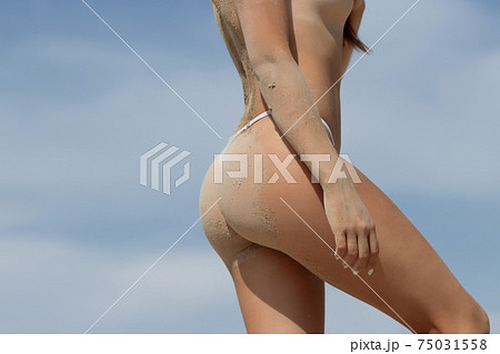 Slim woman with perfect body on beach 75031558