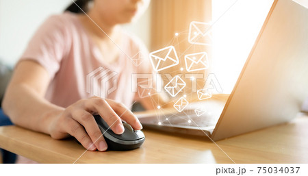 Email marketing concept. Hand using computer sending message with envelope icon 75034037