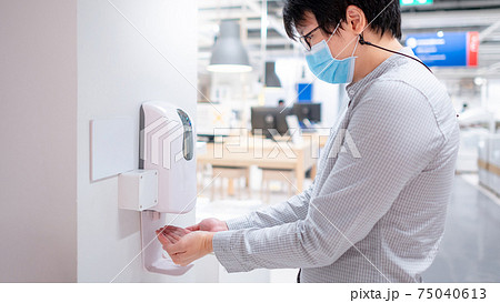Automatic alcohol dispenser in office building Automatic alcohol dispenser in office building 75040613
