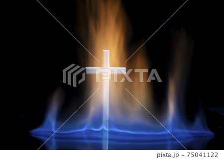 Cross or crucifix surrounded by burning fire flames. Cross or crucifix surrounded by burning fire flames. 75041122