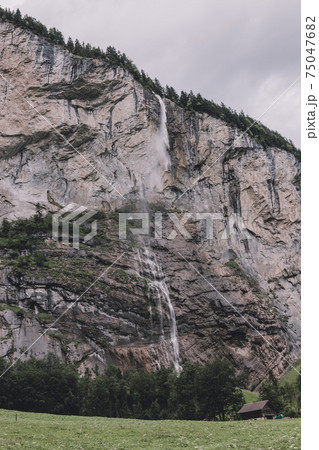 View closeup waterfall Staubbach fall in mountains, valley of waterfalls View closeup waterfall Staubbach fall in mountains, valley of waterfalls 75047682
