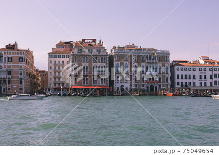 Panoramic view of Grand Canal (Canal Grande) with active traffic boats Panoramic view of Grand Canal (Canal Grande) with active traffic boats 75049654