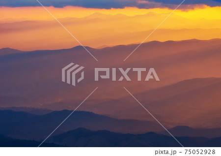 Beautiful sunbeam with warm light over mountain. Beautiful sunbeam with warm light over mountain. 75052928