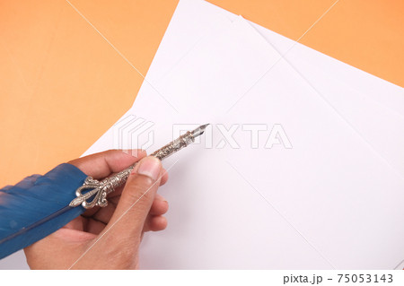 Close up of man hand writing a letter with fountain pen  75053143