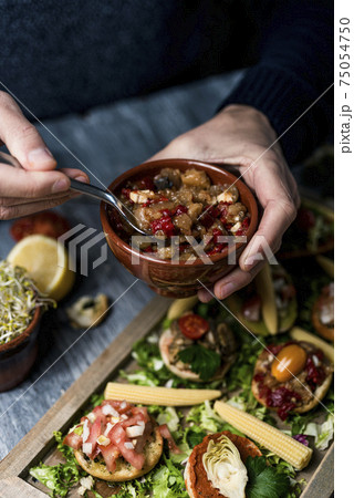 man serving catalan escalivada man serving catalan escalivada 75054750
