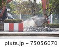 Excavator digging   a road. Construction concept. 75056070