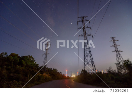 High voltage electricity pylon at night. 75056265