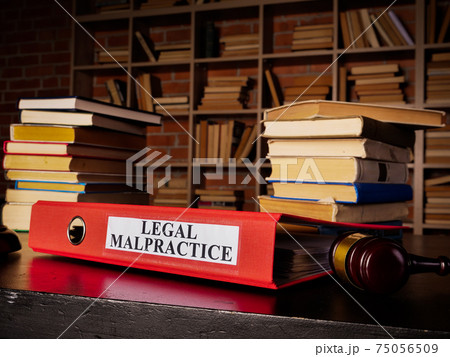 Documents about legal malpractice in the red folder. Documents about legal malpractice in the red folder. 75056509