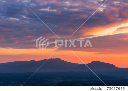 Vivid clouds of sunrise. 75057626