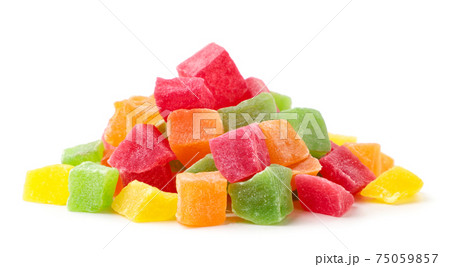 Heap of candied fruit pieces on a white background. Isolated Heap of candied fruit pieces on a white background. Isolated 75059857