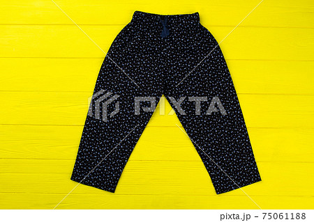Floral pants on yellow table 75061188