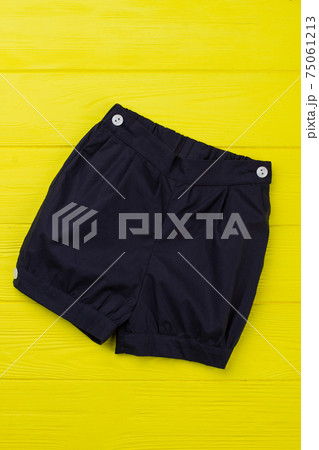 Navy shorts on yellow shelf Navy shorts on yellow shelf 75061213