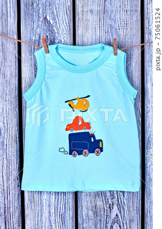 Baby boy printed t-shirt hanging on rope. Baby boy printed t-shirt hanging on rope. 75061524