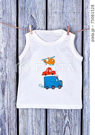 Baby boy t-shirt hanging on rope. Baby boy t-shirt hanging on rope. 75061528