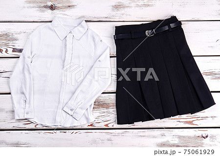 Girls school uniform, top view. 75061929