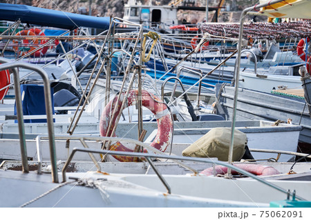 background - details of the structures of the boats standing in the harbor merge with each other 75062091