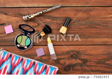 Wooden background with cosmetics. Wooden background with cosmetics. 75062457