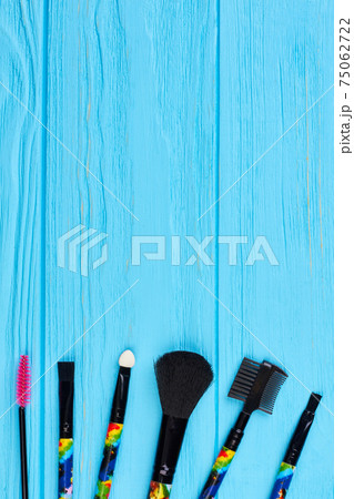 Brushes for makeup on color background. 75062722