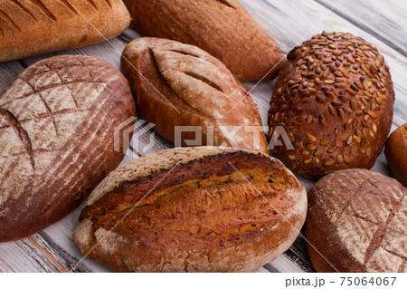 Fresh bread loaves background. 75064067
