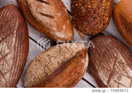 Homemade crusty artisan bread loaves. Homemade crusty artisan bread loaves. 75064071