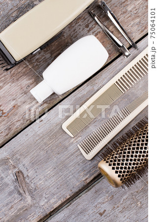 Vintage barber shop tools on rustic wooden background. 75064101