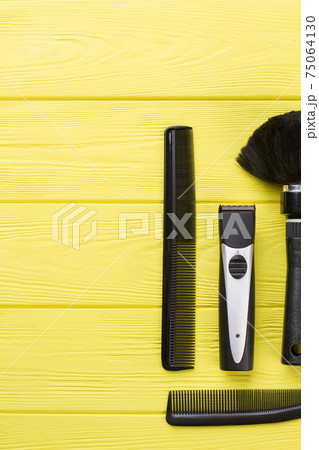 Hairdresser tools on color wooden background. 75064130