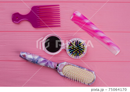Hair combs and brushes on wooden background. 75064170