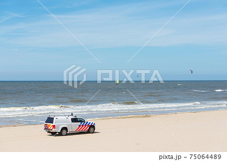 Zandvoort beach, the Netherlands, surf life saving vehicle on the beach 75064489
